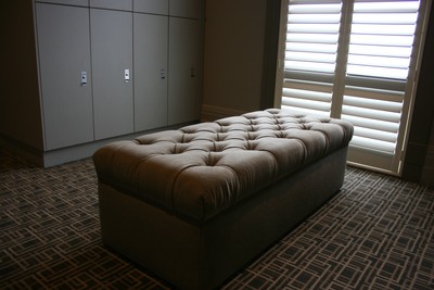 Buttoned locker room ottoman
